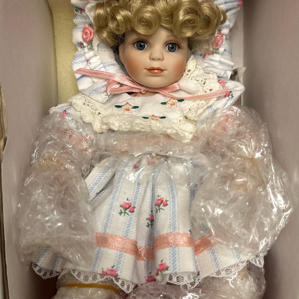 Porcelain Doll with Blonde Curls and Floral Dress